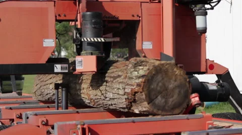 MS Portable sawmill cuts log front angle Stock Footage 40472187