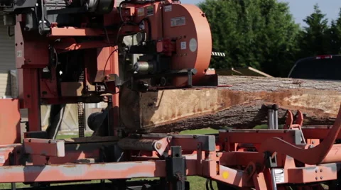 MS Portable sawmill cutting log rear angle Stock Footage 40472166