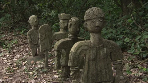MS row of deity sculptures in the Sacred Grove Stock Footage 86761310