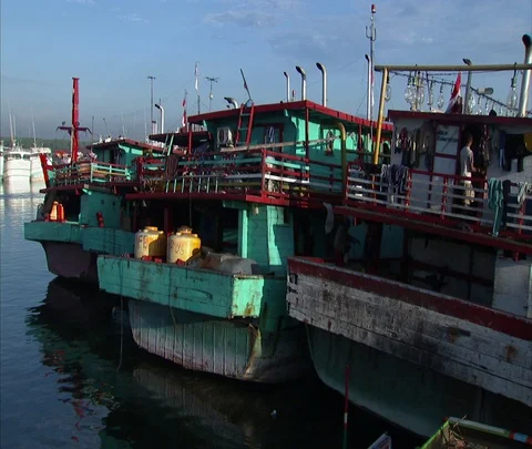 MS three turquoise boats moored in marina Stock Footage 86747890