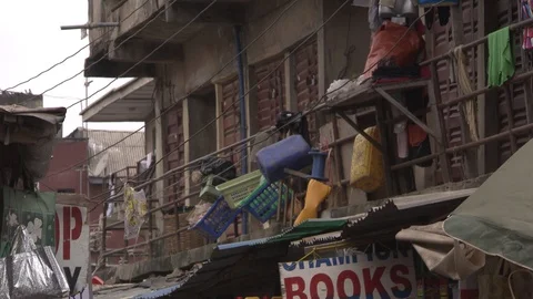 MS tilt down from balconies to very crowded market below. Stock Footage 86760951