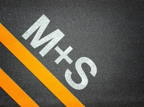M+s tires m&amp;s text writing road asphalt Illustrazione stock