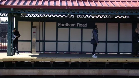 Ms train arriving Fordham road sign in New York City Stock Footage 87056199