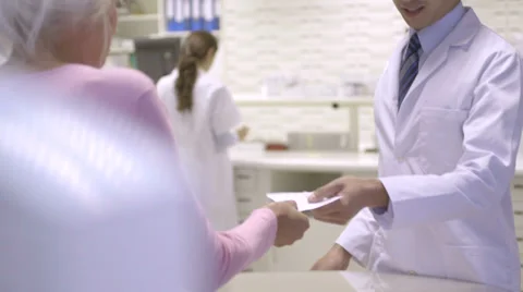 MS TU Pharmacist scanning bar code through bar code reader Video stock 31956673