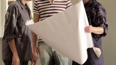 MS, TU of a young couple getting excited after meeting with an architect Stock Footage 10702389