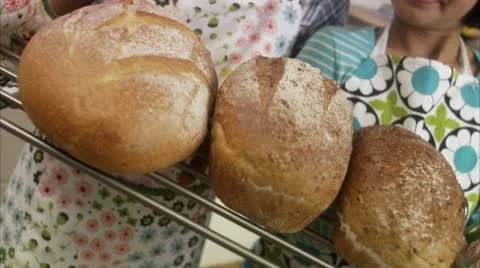 MS Two sisters holding fresh bread Stock Footage 11342389