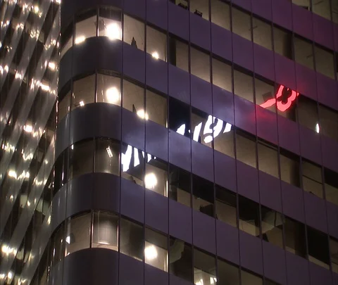 MS windows of illuminated high-rise with neon reflection Stock Footage 86748083