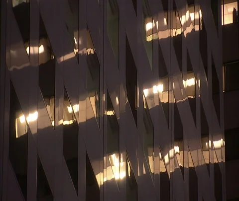 MS windows of illuminated high-rise with abstract reflection Stock Footage 86748120