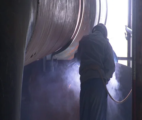 MS worker in hard hat welding inside Shenhua Sanhe power station. Stock Footage 86746053