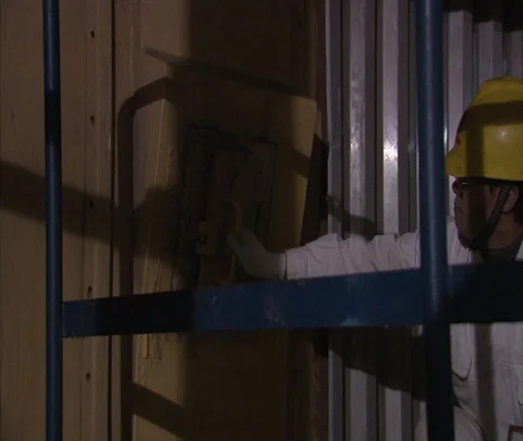 MS workers in hard hats open door to furnace inside Shenhua Sanhe power station Stock Footage 86746563