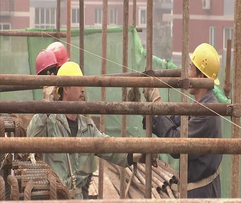 MS workers in hard hats secure scaffolding Stock Footage 86744291