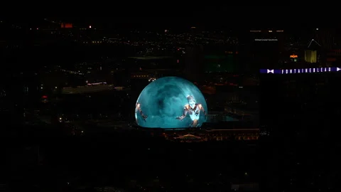 MSG Sphere at night on the Las Vegas Strip, Nevada, USA – Humanoid robot Stock Footage 300484981