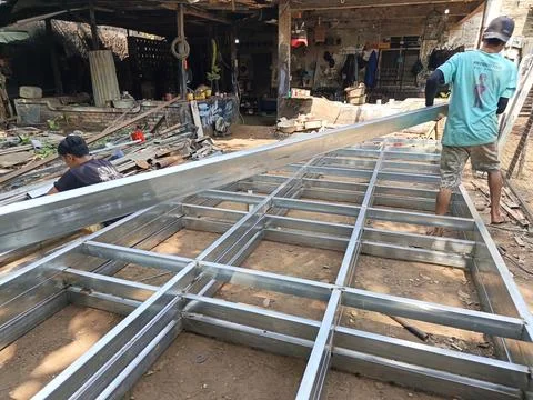 MSME workers assembling galvanized steel hollow iron frames in Yogyakarta Фото