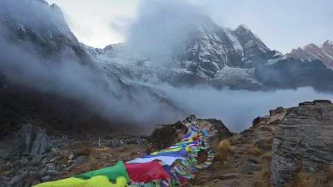 Mt. Annapurna (south) in partial cloud cover with vibrant Tibetan prayer fl.. Stock Footage 311820123