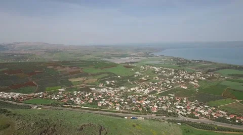 Mt Arbel - View to Migdal and Sea of Galilee (Israel aerial footage) 스톡 동영상 67577161