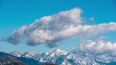Mt Baldy Covered in Snow and Clouds in the sky. Stock Footage 296444429