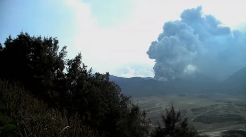 Mt Bromo a remote erupting active barren volcanic mountain volcano Java Stock Footage 67395010