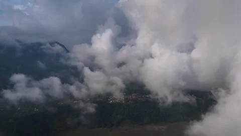 Mt Bromo Town through clouds, East Java, Indonesia 動画素材 320816505