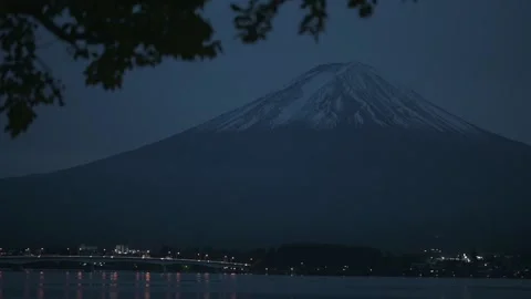 Mt. Fuji during early evening with street lights along Fujikawaguchiko, HD 動画素材 171579153