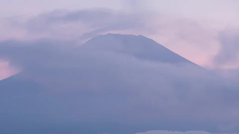 Mt. Fuji Emerging from Clouds at after the Sunset (Time Lapse | Zoom In) Video stock 167105966