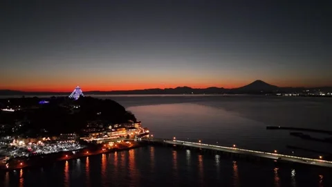 Mt. Fuji | Enoshima Island Nightscape | Japan - 4K Aerial Video Stock Footage 329054935