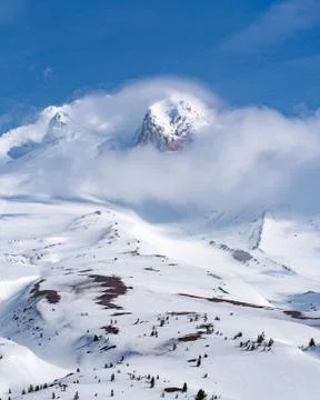 Mt Hood peaking through clouds Stock Photos