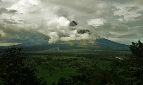 Mt Mayon hidden behind the clouds Stock Photos