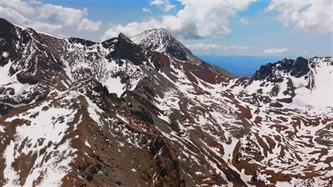 Mt Mount Lindsey Spring summer snow fields melting morning blue sky clouds Stock Footage 316399936