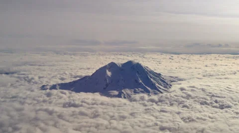Mt. Rainier poking through the clouds - aerial Stock Footage 36241639