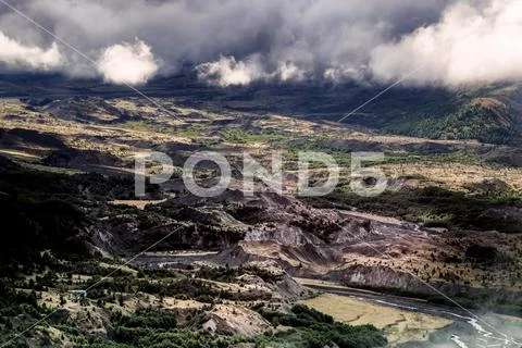 Mt. St. Helens area foggy cloudy forest valley with river Stock Photos