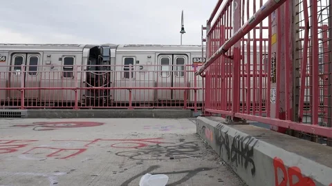 MTA Train Passes Graffiti Covered Williamsburg Bridge Stock Footage 128008378