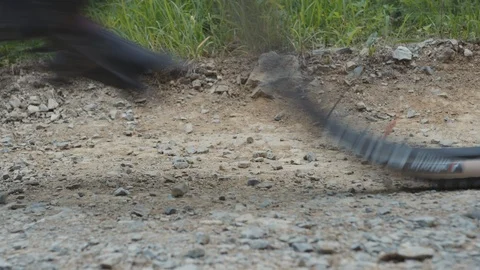 MTB riders passing by quickly on rocky road Stock Footage 117007682