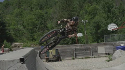 MTB tire slide trick on mountain bike skatepark Stock Footage 157168752