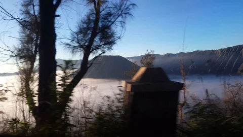 Mt.Bormo Volcano short from moving car, indonesia Stockbeeldmateriaal 115962499