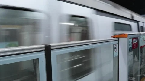 MTR train passing by Stock Footage 306442010