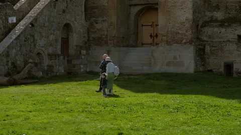 Mtskheta, Georgia - 5.14.2023: Tourists walking at Svetitskhoveli Cathedral Stock Footage 258339945