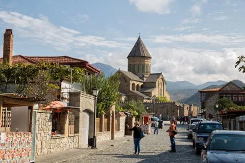MTSKHETA, GEORGIA - SEPTEMBER 23, 2018: Tourists on street of old town Mtskhe Stock Photos