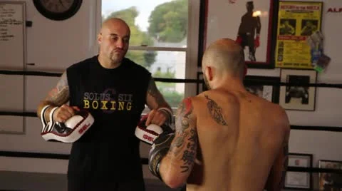 Muay Thai fighter practice his techniques with a coach in slow motion Stock Footage 22085196