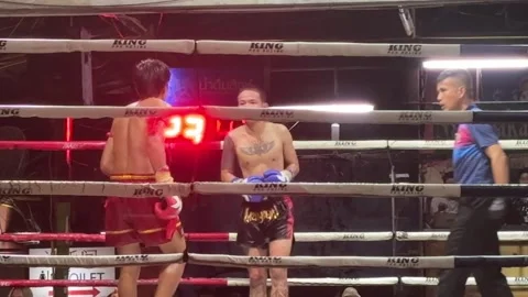 Muay Thai fighters fighting in ring with referee at Kalare Stadium Vídeo Stock 331038716