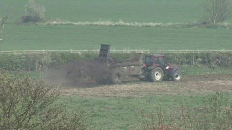 Muck spreader moves left to right Stock Footage 316727