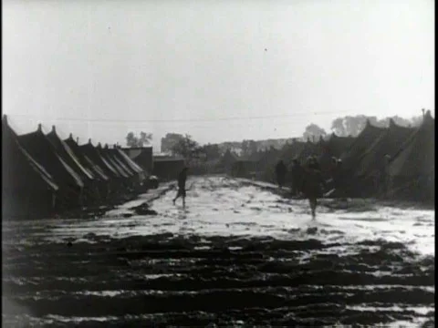 Mud and flooding slow down the advancement of Allied troops and vehicles givingƒ Stock Footage 75278278