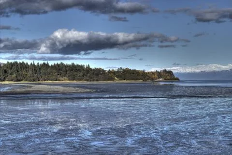 Mud bay with clouds Stock Photos