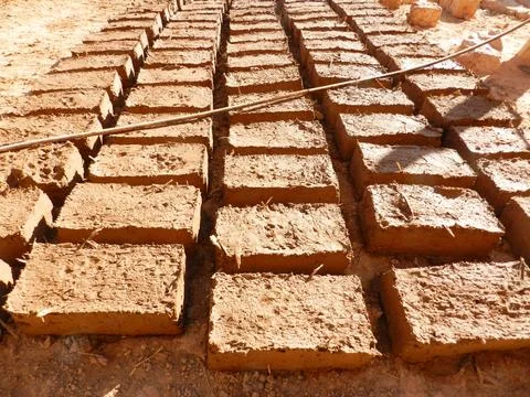Mud bricks drying in the sun in the Sahara Desert of Morocco Foto stock