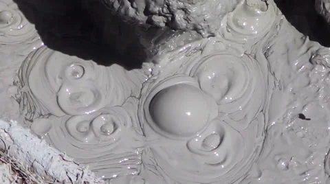 Mud bubbling in a hot spring Stock Footage 38260210