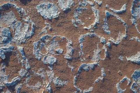 Mud cracks on clay soil with red sand. Sossusvlei, Namib Naukluft National .. Stock Photos