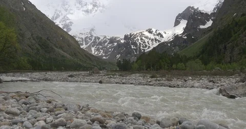 Mud flow in dirty river in mountains during rain Stock Footage 77244006