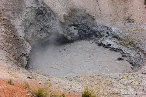 Mud pool bubbling in geothermal area showcasing natural volcanic activity i.. Stock Photos