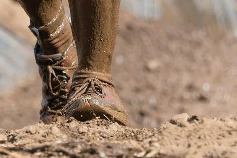 Mud race runners Stock Photos