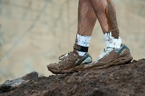 Mud race runners Stock-Fotos