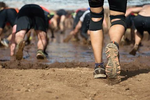 Mud race runners Stock Photos